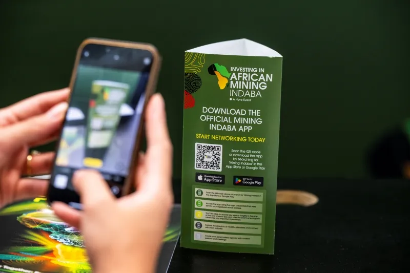 Attendee scanning a QR code to download the Mining Indaba app