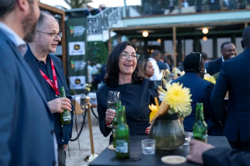 Investors networking with mining industry leaders at a Mining Indaba reception